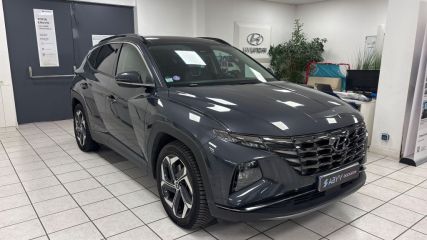 95500 : Hyundai Gonesse - ABVV - HYUNDAI TUCSON Executive - TUCSON IV - Gris - Boîte automatique - Essence / Courant électrique
