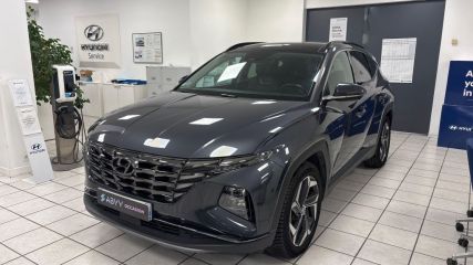 95500 : Hyundai Gonesse - ABVV - HYUNDAI TUCSON Executive - TUCSON IV - Gris - Boîte automatique - Essence / Courant électrique
